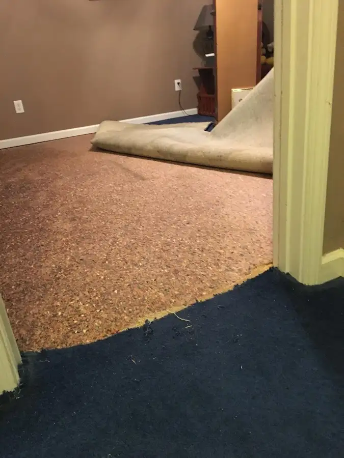 Carpet pad removal revealing water damage during Drying & Dehumidification in Kingfisher